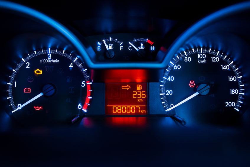 a car dashboard showing speedometer, fuel gauge, odometer, etc.