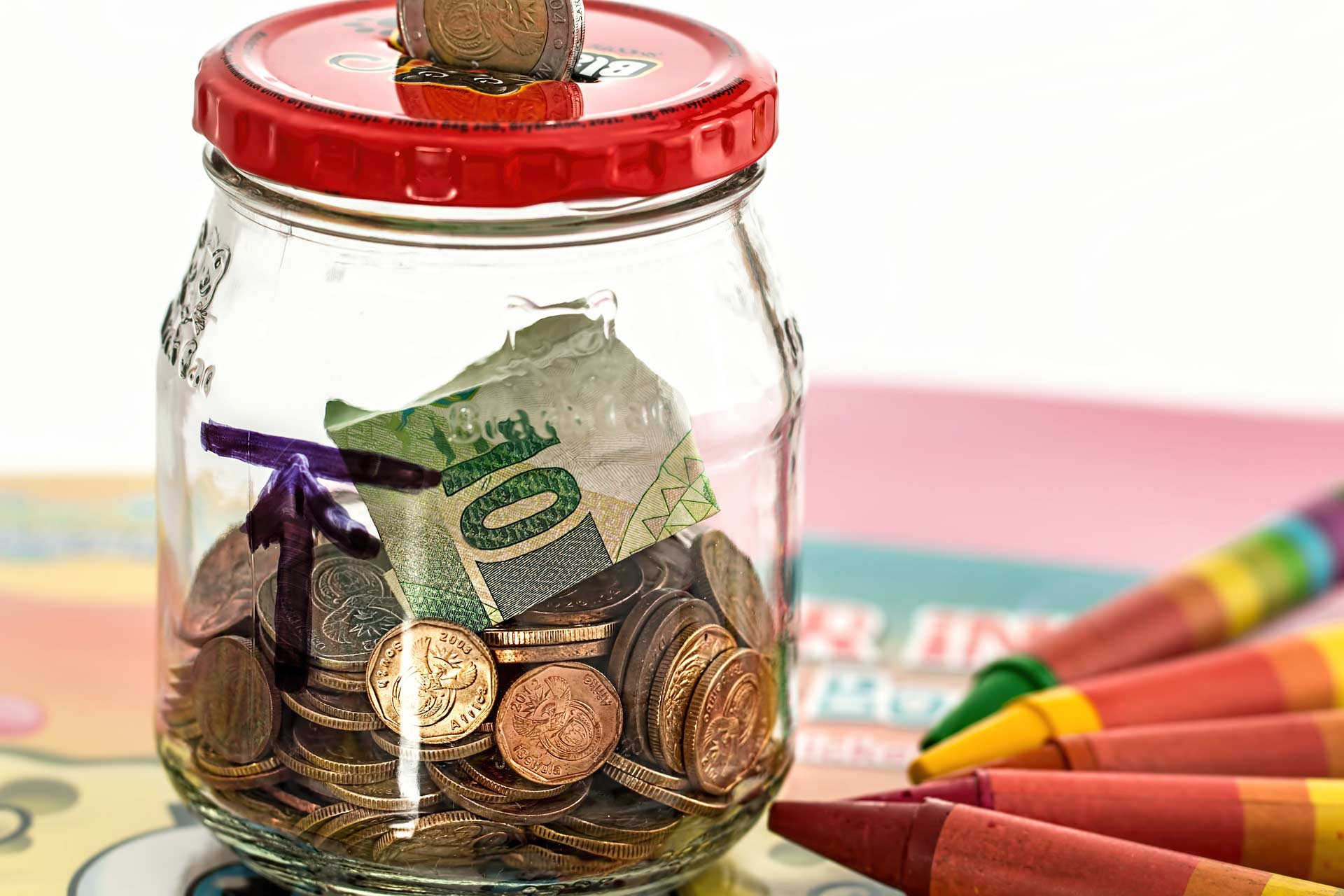 Savings jar with coins