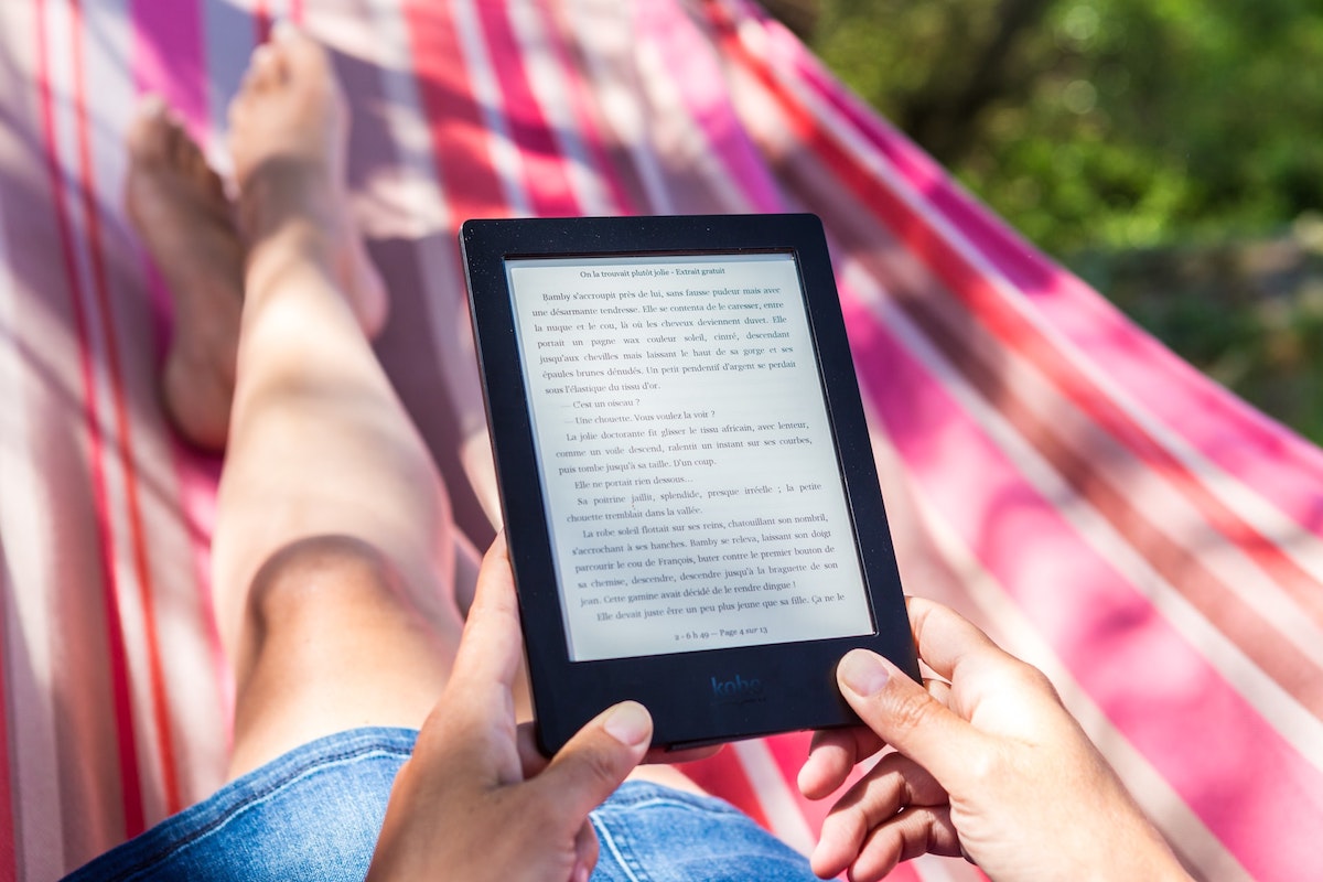 Reading e-reader outdoors