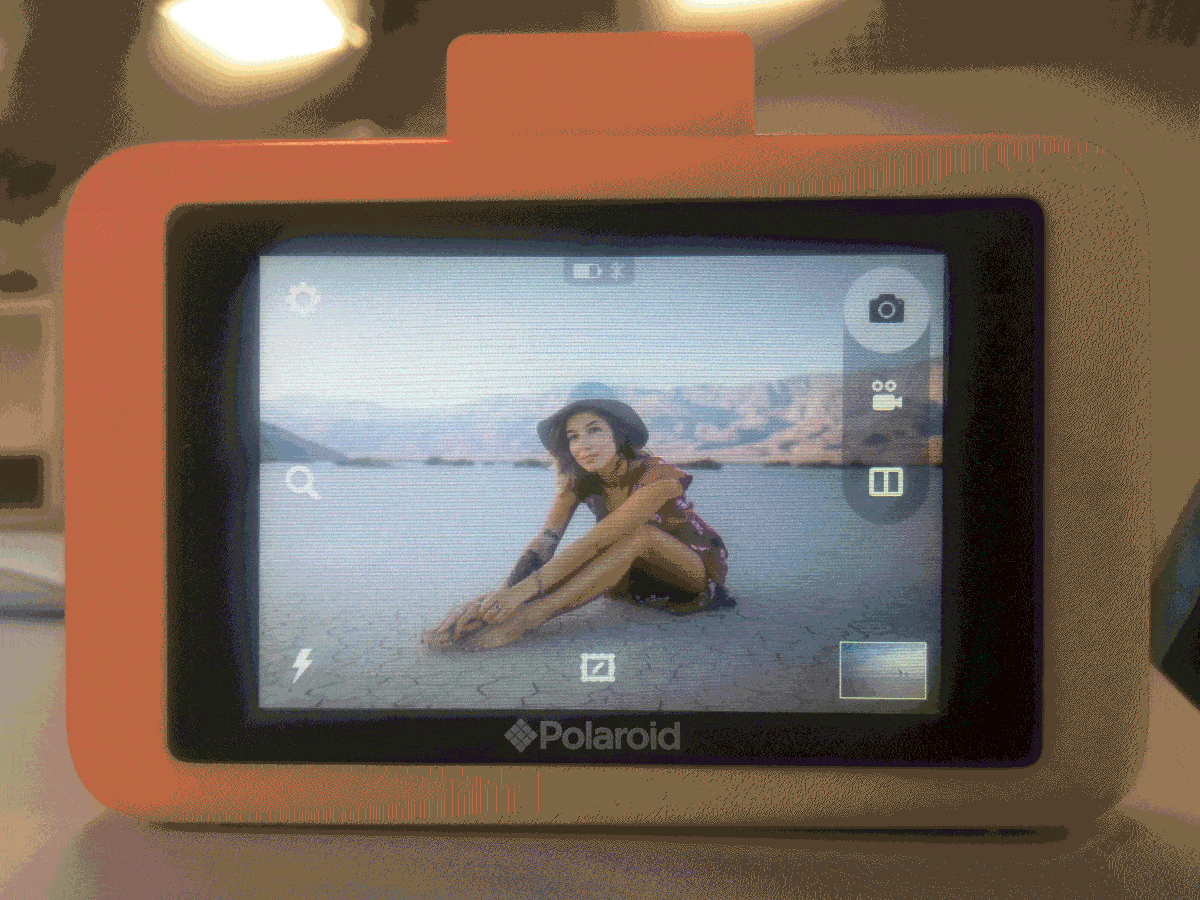 Animated sequence of photos of the Polaroid camera interface